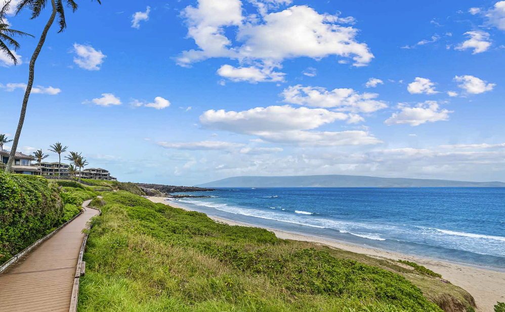 a view of a beach next to a body of water